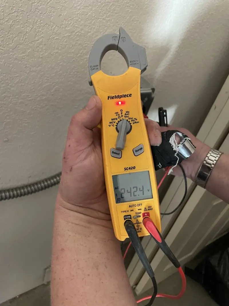 Voltage testing with clamp meter during Electrical Installation Services in Waynesboro
